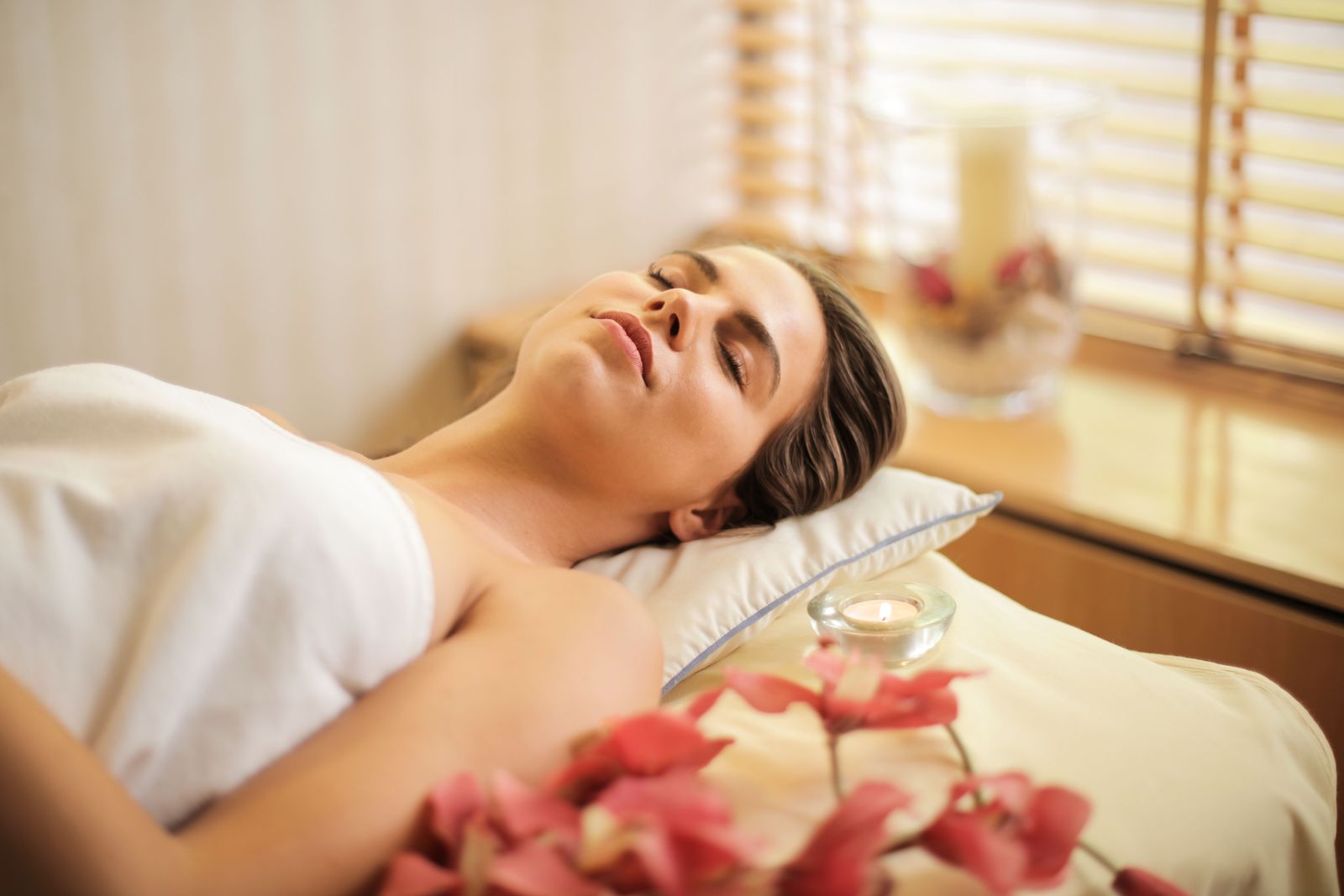A woman relaxing during a calming spa massage
